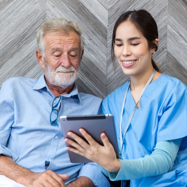 Nurse helping patient for using tablet